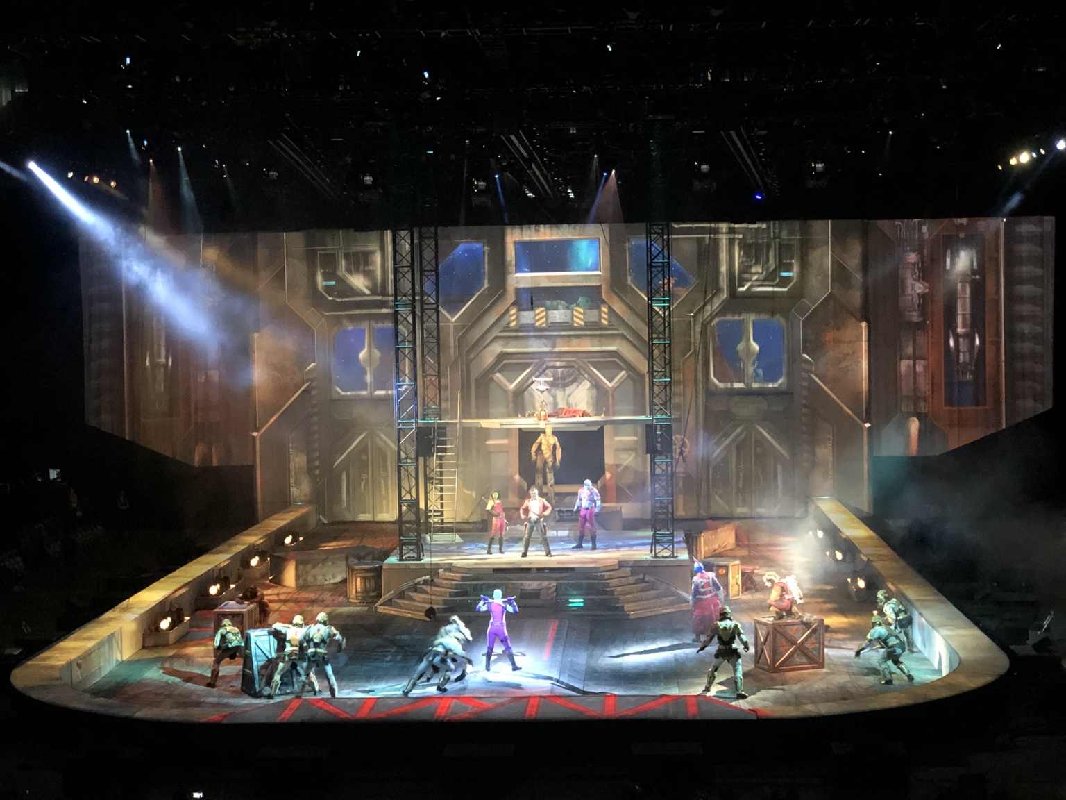Marvel Universe Live! arena stage with scenic structures, performers and colorful lighting