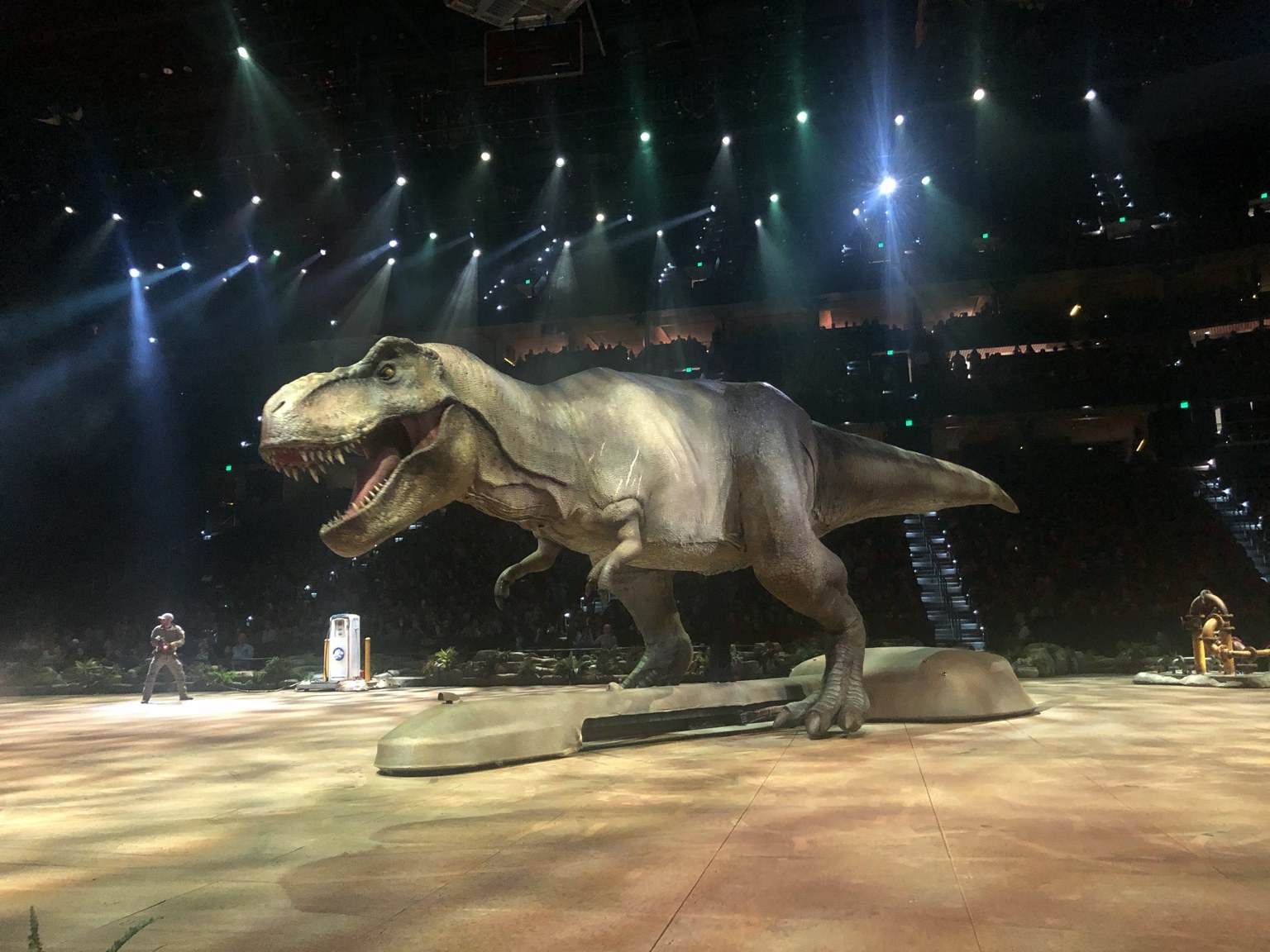 A large dinosaur on the arena floor during Jurassic World Live Tour