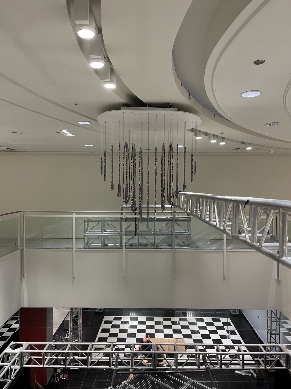 Suspended artwork viewed from the angle that reveals a heart