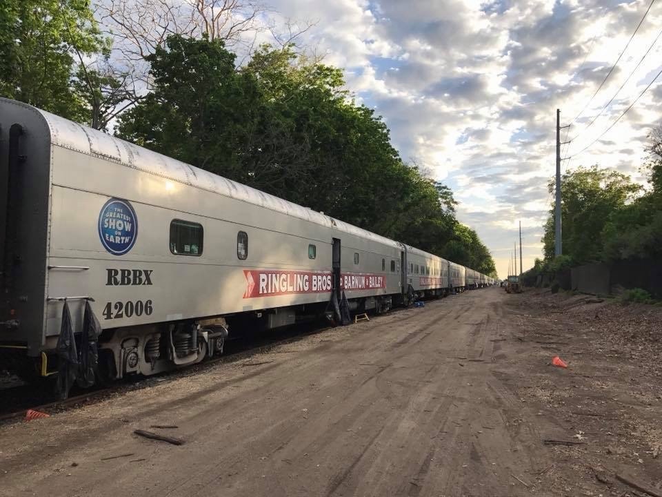 Ringling Bros. and Barnum and Bailey train extending along a railway siding