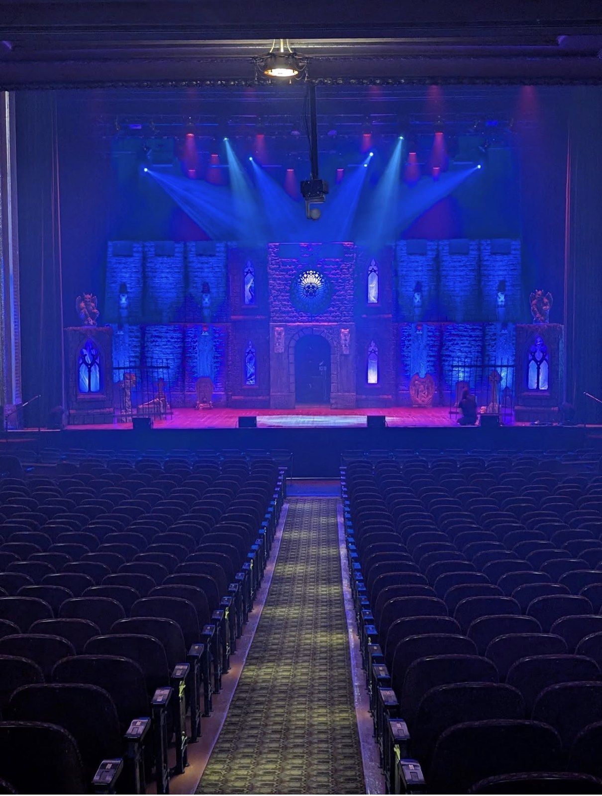 The Vampire Circus stage and theatre seating under blue and purple lighting
